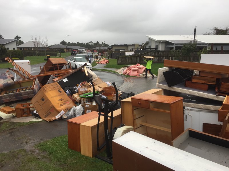 Household goods stacked for waste collection - close up.JPG